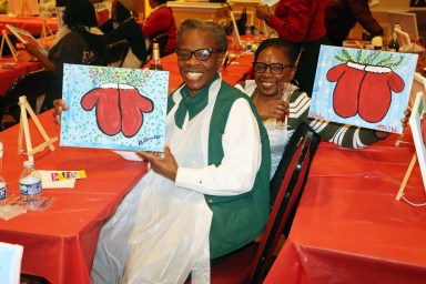 Trinidadian Marlene Ferguson, in the foreground, and Grenadian Natalie Wilson, display their finished product.