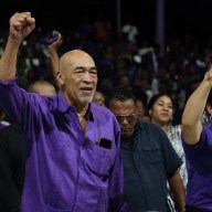 Suriname's former President Desi Bouterse (C) and his wife Ingrid Bouterse-Waldring attend a rally at his NDP party centre, where he asked supporters to calmly wait for the High Court of Justice verdict in his appeals case against the Court Martial, in Paramaribo, on Dec. 16, 2023. The prosecution repeated the demand for 20-years jail time for his involvement in the murder of 15 people when he ruled in 1982 during his military government.