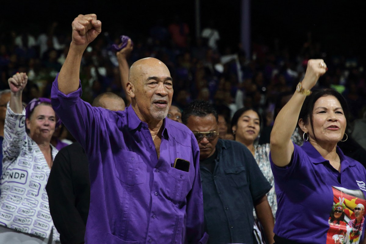 Suriname's former President Desi Bouterse (C) and his wife Ingrid Bouterse-Waldring attend a rally at his NDP party centre, where he asked supporters to calmly wait for the High Court of Justice verdict in his appeals case against the Court Martial, in Paramaribo, on Dec. 16, 2023. The prosecution repeated the demand for 20-years jail time for his involvement in the murder of 15 people when he ruled in 1982 during his military government.