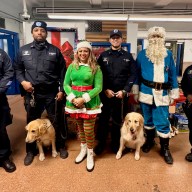 From left: DOC Officer McLeish, Officer Joseph-Pauline with k-9 Lenox, President of First Responders LC Dimple Willabus, Officer Guzman with K-9 Onix, Police-Clause, and Officer Stephen.