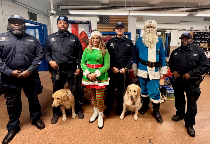 From left: DOC Officer McLeish, Officer Joseph-Pauline with k-9 Lenox, President of First Responders LC Dimple Willabus, Officer Guzman with K-9 Onix, Police-Clause, and Officer Stephen.