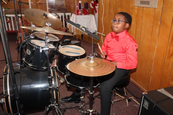 Nicholas Charles plays the drums.