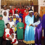 Pastor the Rev. Roger Jackson, who portrays "King Herod" with Mary and Joseph, second and third from right, with Baby Jesus, and the cast of the pageant, "Good Keeps His Promise."