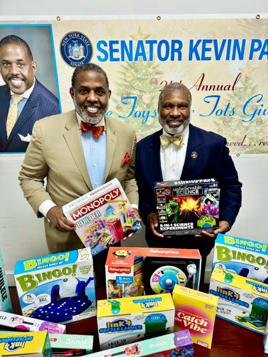 NYS Senator Kevin Parker left, with Noble James Vaugh of Medina Temple #19 during the toy distribution at his Brooklyn District 21 Office.