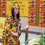 Professor Simanique Moody of Brooklyn College lights the Mishumaa Saba Candles during a pre-Kwanzaa commemoration in partnership with Marine Park Alliance and Brooklyn College, last Saturday at Carmine Carro Community Center in Brooklyn.