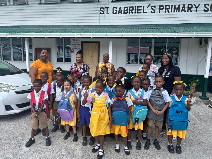 Dr. Gill giving back to her primary school in Georgetown, Guyana.