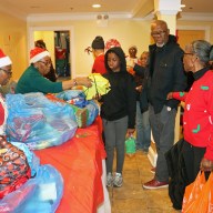 Members of the Family Life Ministry distribute gifts to children.