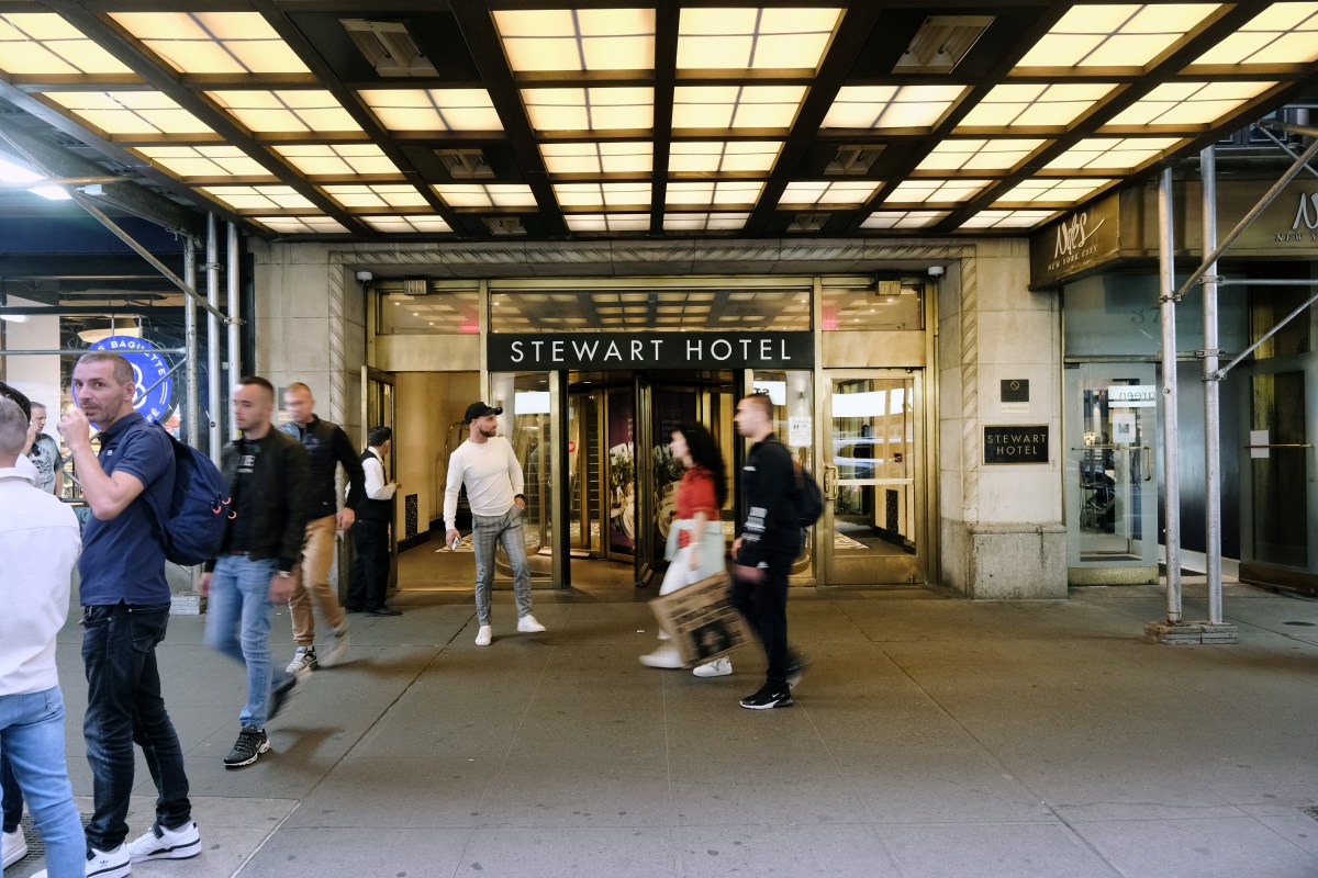 The Stewart Hotel in midtown Manhattan is being used as an intake and assessment center for recently arrived immigrants on October 07, 2022 in New York City. A parking lot is being prepared on Randall's Island for the arrival of migrants that have arrived from Texas. After cancelling the plan to house asylum seekers in tents on Orchard Beach, Mayor Eric Adams is now preparing to move the site to Randall's Island.