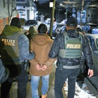 Law enforcement walk with Leonardo Fabian Cando Juntamay as he was detained in the Bronx during ICE led operations to apprehend illegal immigrants on Tuesday Jan. 28, 2025 in New York, NY.