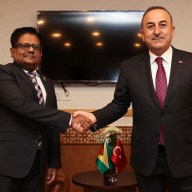 Turkish Foreign Minister Mevlut Cavusoglu (R) meets with Guyana's Finance Minister Dr. Ashni Singh (L) within the 48th Foreign Ministers Council Meeting of Organization of Islamic Cooperation in Islamabad, Pakistan on March 22, 2022.