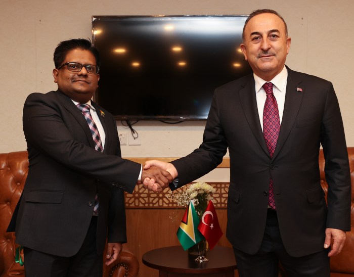 Turkish Foreign Minister Mevlut Cavusoglu (R) meets with Guyana's Finance Minister Dr. Ashni Singh (L) within the 48th Foreign Ministers Council Meeting of Organization of Islamic Cooperation in Islamabad, Pakistan on March 22, 2022.