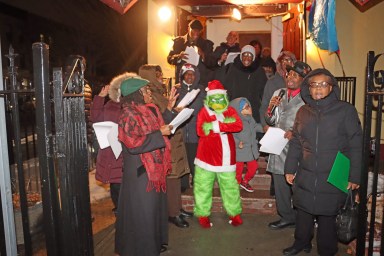 Singing Christmas Carols on Christmas Eve Night on the steps of Fenimore Street United Methodist Church with Santa.