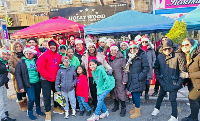 Keren Espinoza, center, surrounded by Help Us Help the World Foundation members and community leaders during the Christmas toy giveaway.