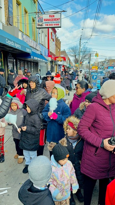 Liberty Avenue was packed with hundreds of children receiving gifts and treats.