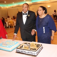 Martin and Margaret Clement get ready to cut the cake.