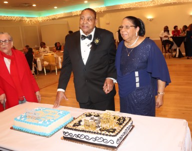 Martin and Margaret Clement get ready to cut the cake.