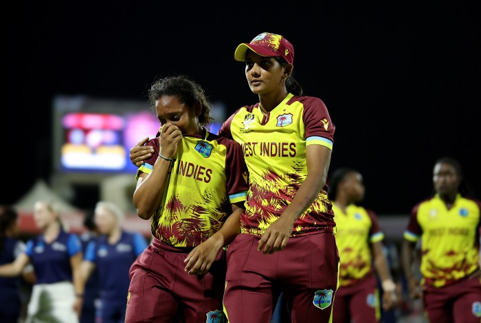 Zaida James of West Indies is consoled by teammate Karishma Ramharack after defeat to New Zealand during the ICC Women's T20 World Cup Semi-Final 2024 match between West Indies and New Zealand at Sharjah Cricket Stadium on Oct. 18, 2024 in Sharjah, United Arab Emirates.