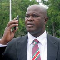 Ex-rebellion Ronnie Brunswijk speaks on the mobile phone on June 30, 2010 in Paramaribo. Brunswijk was among 50 people to be sworn in as member of Suriname parliament (DNA).