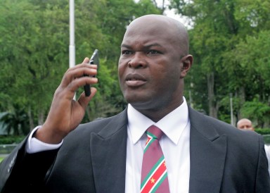 Ex-rebellion Ronnie Brunswijk speaks on the mobile phone on June 30, 2010 in Paramaribo. Brunswijk was among 50 people to be sworn in as member of Suriname parliament (DNA).