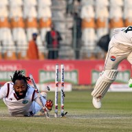 West Indies' Jomel Warrican (L) run out Pakistan's captain Shan Masood during the second day of the first Test cricket match between Pakistan and West Indies at the Multan Cricket Stadium in Multan on Jan. 18, 2025.