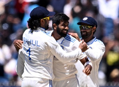 FILE PHOTO: Cricket - Fourth Test - Australia v India - Melbourne Cricket Ground, Melbourne, Australia - December 29, 2024 India's Jasprit Bumrah celebrates with KL Rahul and teammates after taking the wicket of Australia's Travis Head James Ross/AAP Image via REUTERS