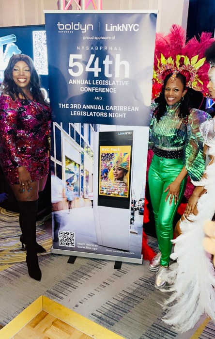 New York State Assemblywoman Latrice M. Walker and New York State Assemblywoman Monique Chandler-Waterman posing at the Caribbean Night Reception held at the Hilton Albany Grand Ballroom.