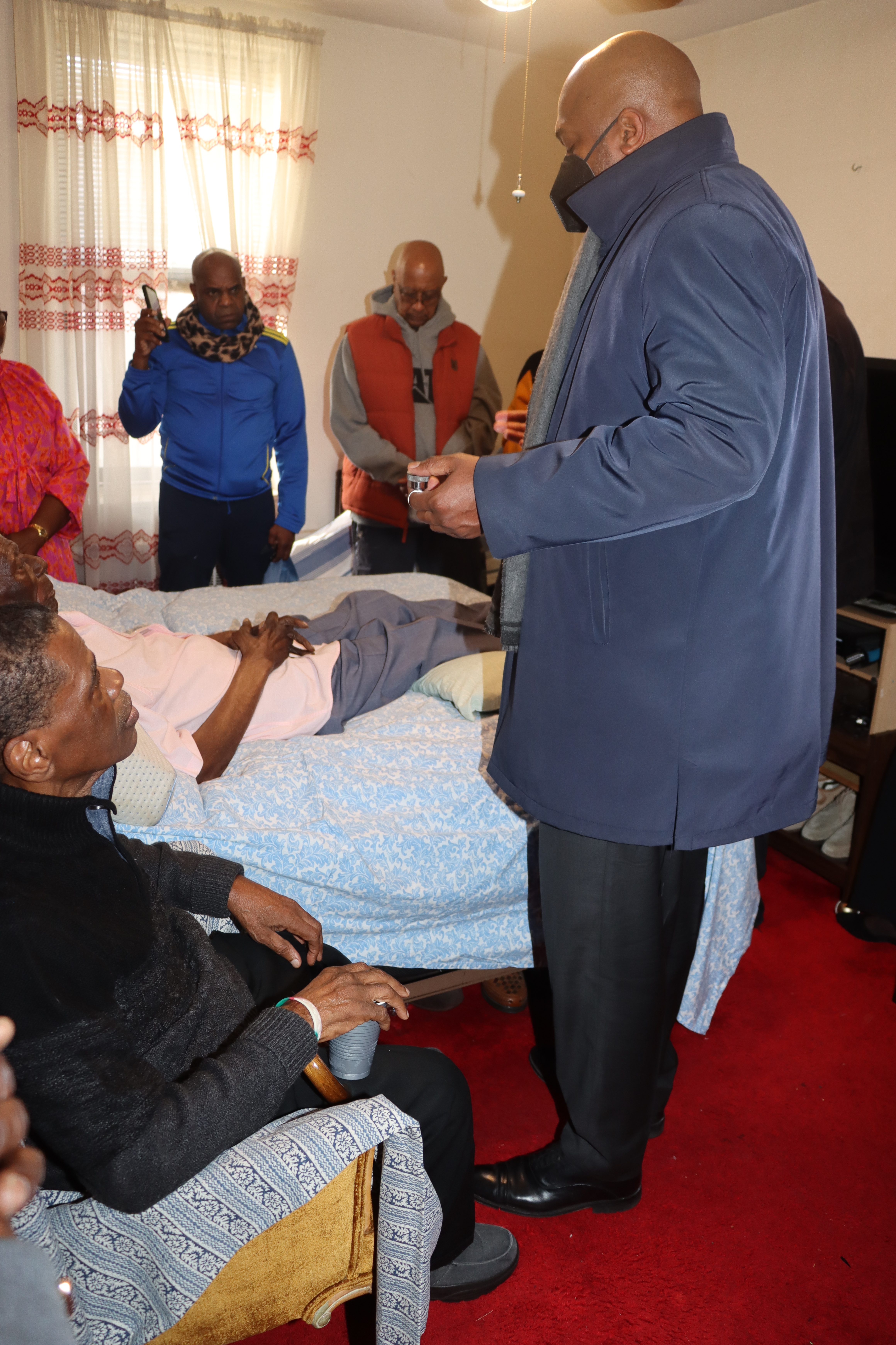 St. Lucian priest the Rev. Kino Vitet blesses James