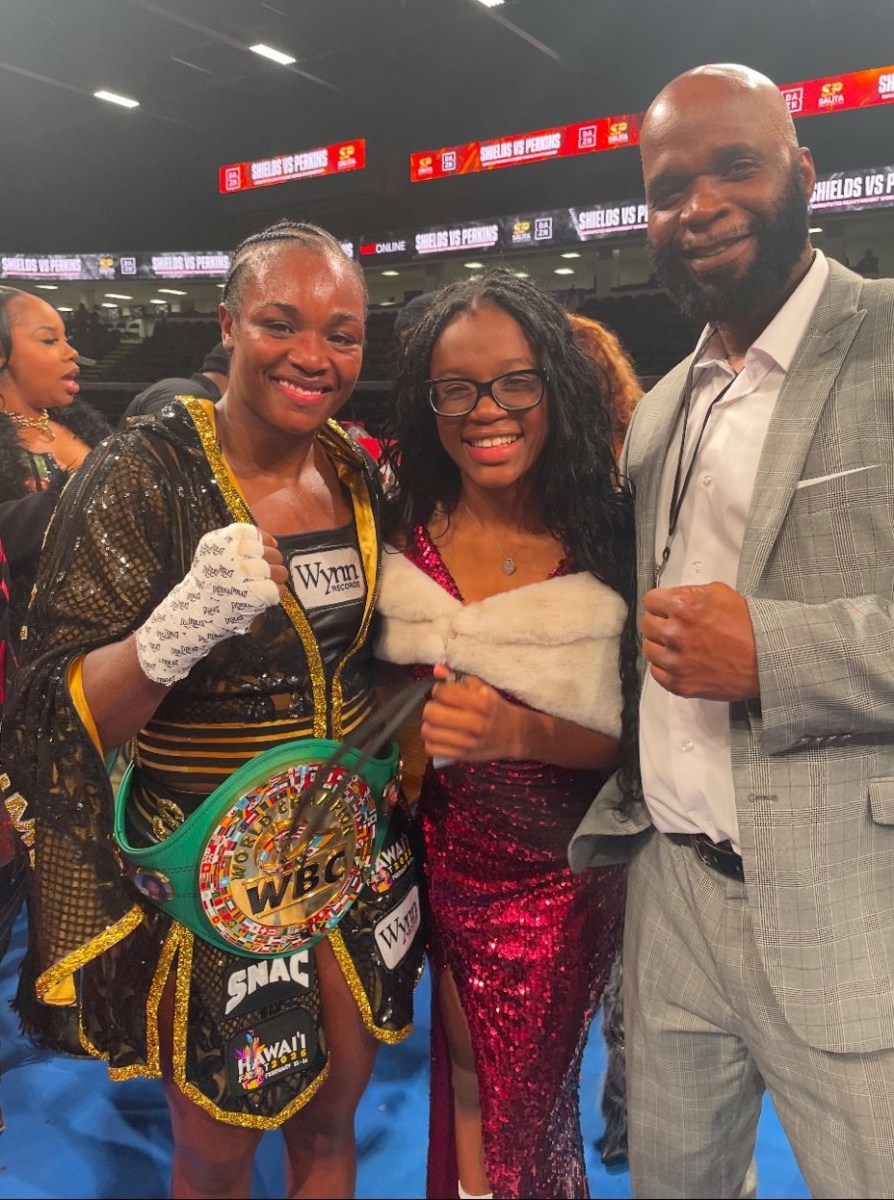 . Heavyweight boxing champion Clarissa Shields, left, shares lens time with 12-year-old Jamaican-Canadian singing/acting prodigy Jazmin Headley and her dad Mark Headley at Sunday's women's boxing title match between Danielle Perkins and Shields.