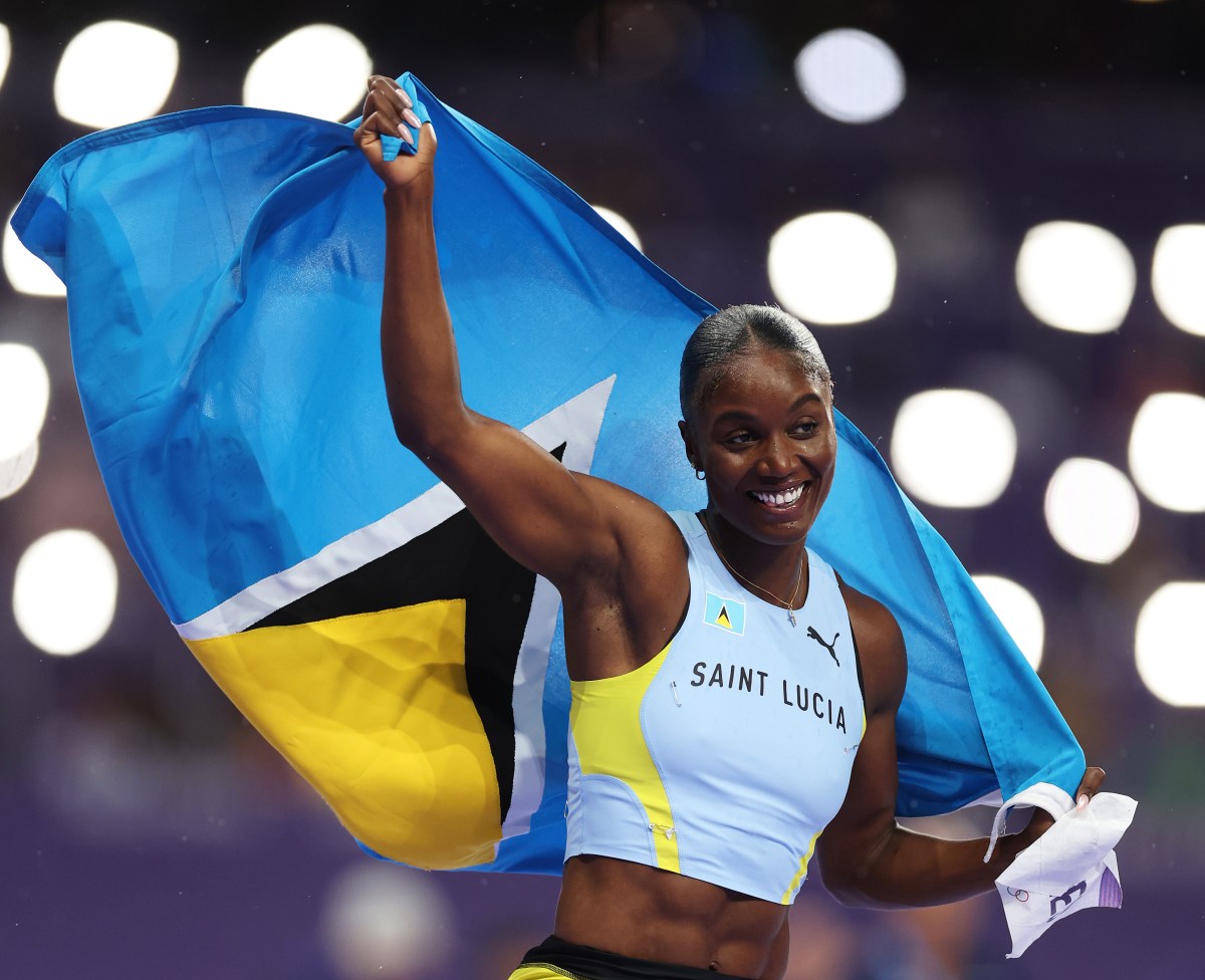 Julien Alfred of Team Saint Lucia celebrates winning the gold medal during the Women's 100m Final on day eight of the Olympic Games Paris 2024 at Stade de France on Aug. 03, 2024 in Paris, France.