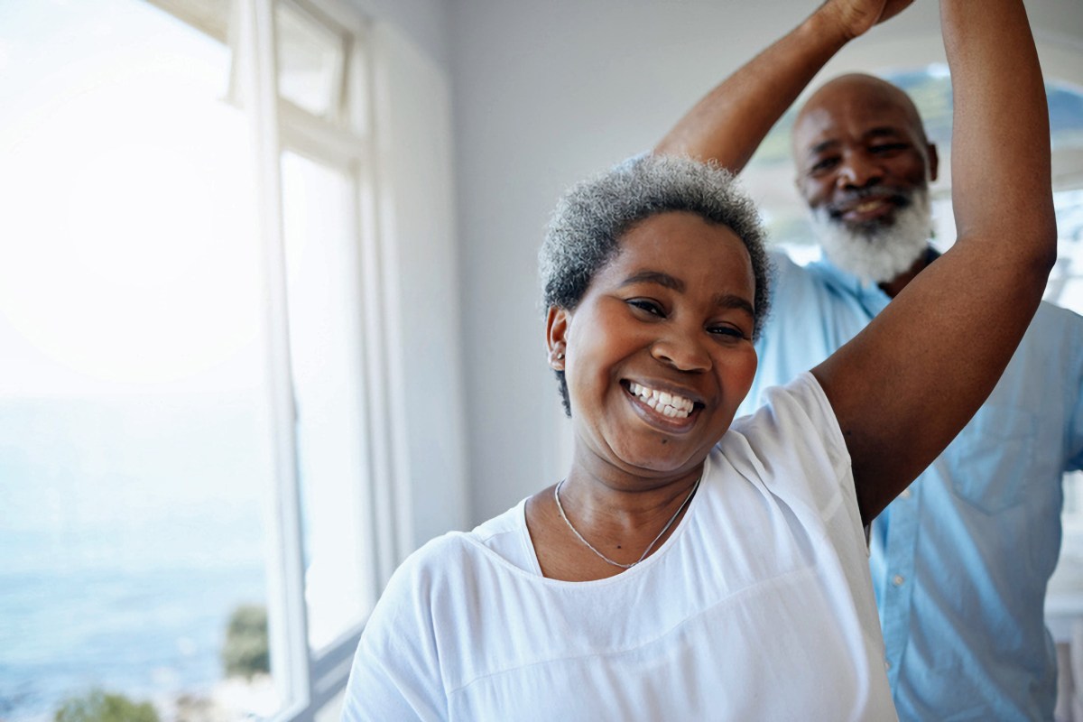 Shot of a mature couple sharing a dance inside